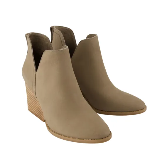 Taupe ankle boots with a wedge heel and subtle stitching details.