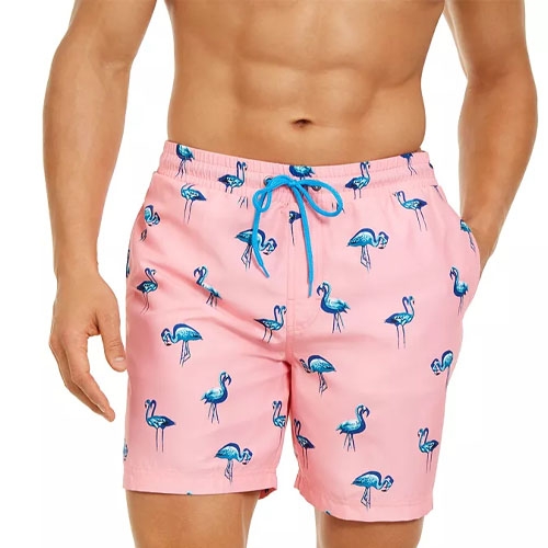 Pink swimming trunks with blue flamingo patterns, featuring a blue drawstring waist.