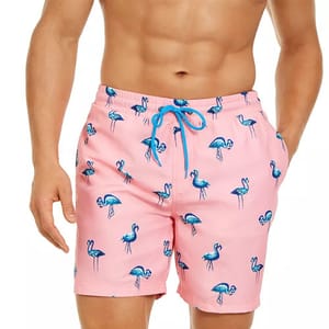 Pink swimming trunks with blue flamingo patterns, featuring a blue drawstring waist.