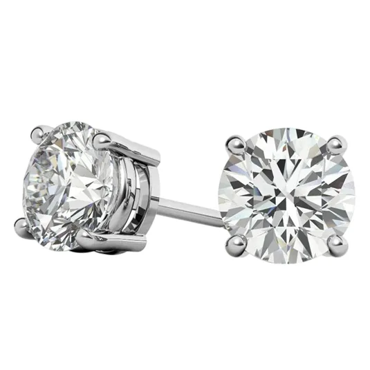 A pair of round-cut diamond stud earrings with a four-prong setting in a silver or white gold metal.