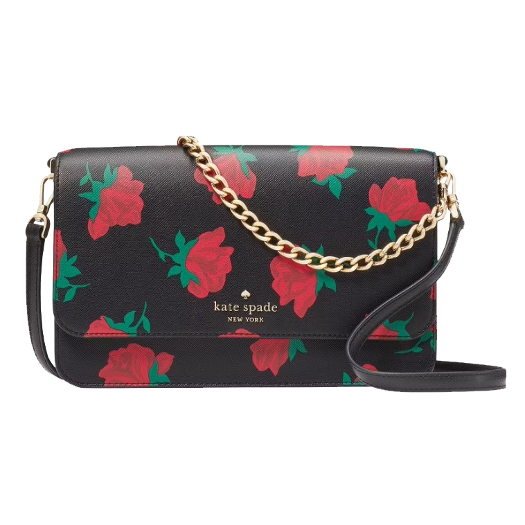 Kate Spade New York crossbody bag with a black base and red rose pattern, featuring a gold chain and leather strap.