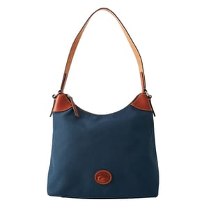 A blue shoulder bag with brown leather accents and a single strap. The bag features a circular leather logo detail on the front.
