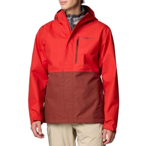 A two-tone red and brown Columbia jacket with a hood and a zippered chest pocket, worn over a gray inner layer.