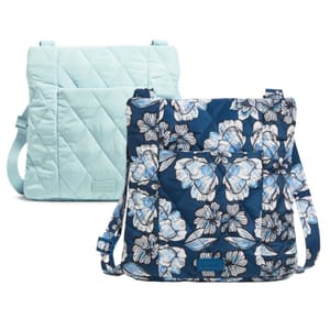 Two quilted shoulder bags, one solid light blue and one patterned with blue and white flowers.