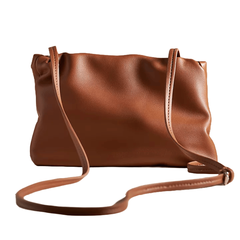 Brown faux-leather clutch with a smooth finish, featuring a gathered design at the top and a thin crossbody strap.