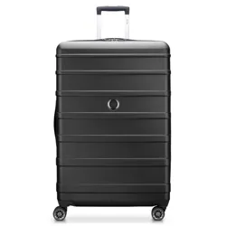 A black hardshell suitcase with four spinner wheels and a telescopic handle, featuring horizontal grooves and a circular logo near the center.