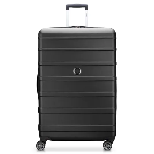 A black hardshell suitcase with four spinner wheels and a telescopic handle, featuring horizontal grooves and a circular logo near the center.