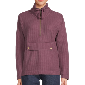 A plum-colored L.L. Bean Waffle Anorak featuring a half-zip front, high collar with drawstring, and a front flap pocket with button details, paired with dark jeans.