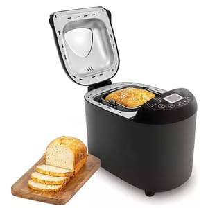 The 2lb Elite Programmable Bread Machine is a sleek black appliance with an open lid showing a loaf of bread inside. It features a digital control panel on top and is accompanied by a wooden board with sliced bread.