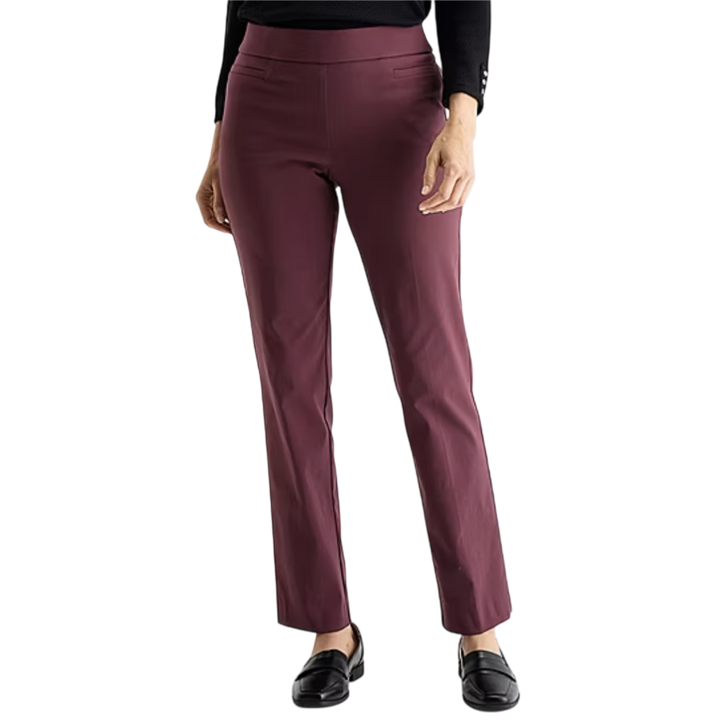 A person wearing burgundy straight-leg pants paired with black loafers and a black top.