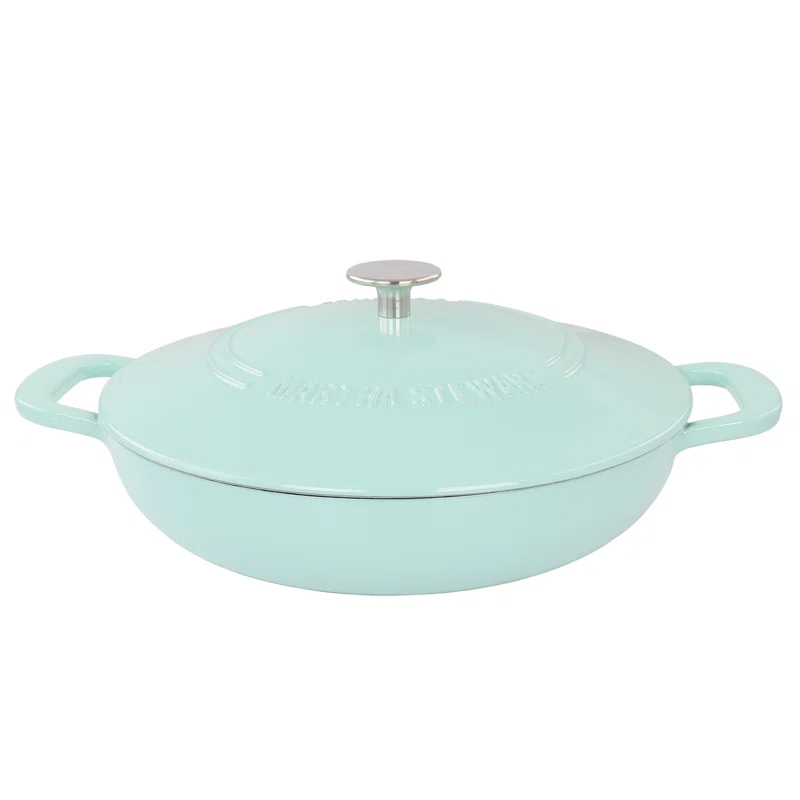 A light blue Martha Stewart 3.5-quart enameled cast iron braiser with a lid, featuring two side handles and a metal knob on top.