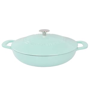A light blue Martha Stewart 3.5-quart enameled cast iron braiser with a lid, featuring two side handles and a metal knob on top.