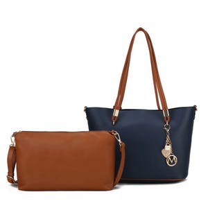 A two-piece set featuring a navy blue tote with brown handles and gold-tone accents, accompanied by a matching brown pouch with an adjustable strap. The tote is adorned with a decorative keychain.