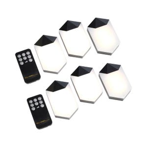 The 6pk Touch Wall Lights set includes six hexagonal wall lights with a touch on/off feature and two remote controls for adjustable brightness and timer settings. The lights have a sleek design with black accents.