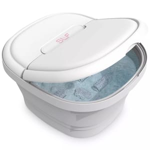 A collapsible foot spa with a white lid, featuring blue bubbling water and massage rollers inside.