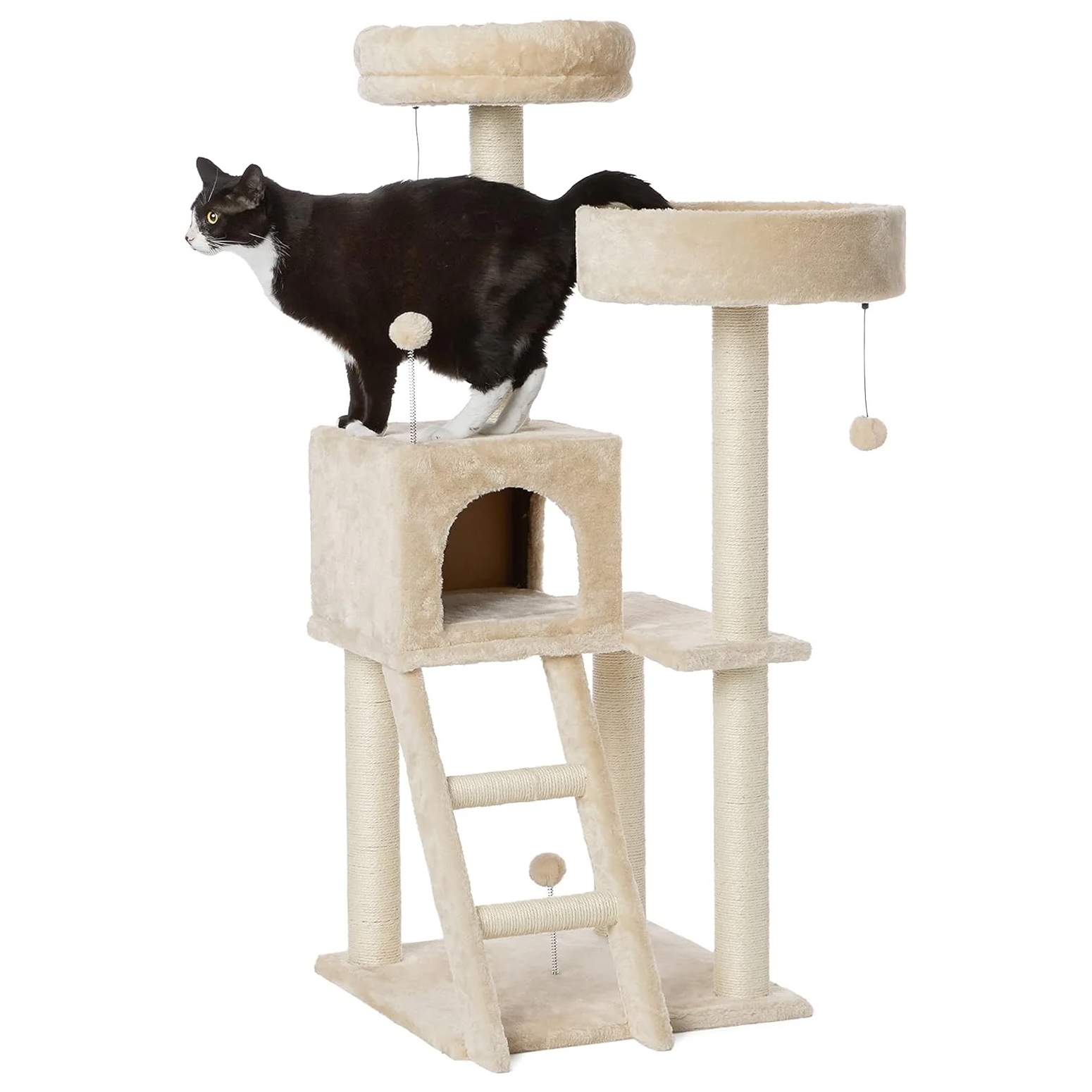 A multi-level cat tree with scratching posts, platforms, a ladder, a cubby, and hanging toy, accompanied by a black and white cat.