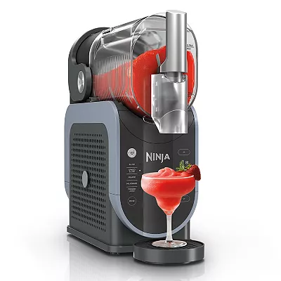 A Ninja SLUSHi Maker is depicted serving a frozen strawberry drink into a glass; the machine has a sleek black and gray design with a clear hopper on top.
