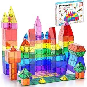 Colorful magnetic building blocks constructed into various shapes, with a box labeled \“PicassoTiles\“ in the background.