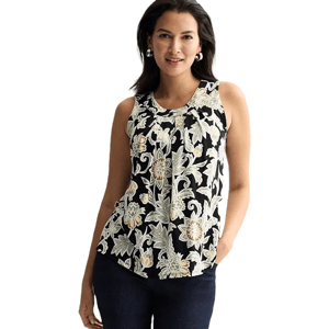 Sleeveless floral blouse with a black background, featuring beige and white floral patterns. The model is wearing dark jeans and hoop earrings.