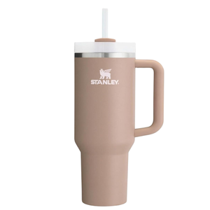 A taupe Stanley tumbler with a handle and straw, featuring a logo and a stainless steel rim.