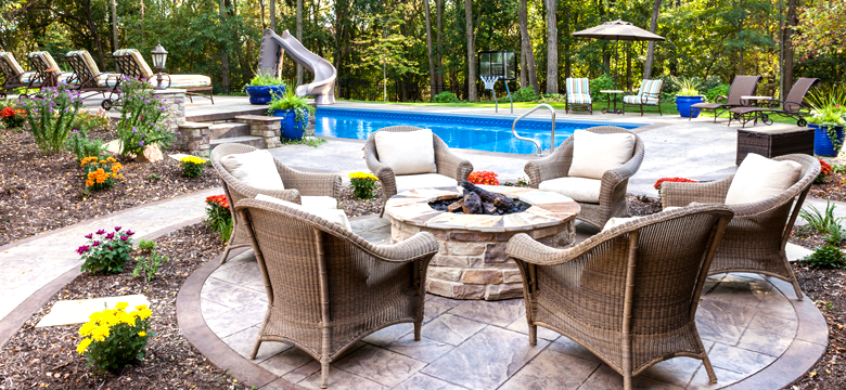 A beautiful outdoor patio furniture set perfect for poolside relaxation.