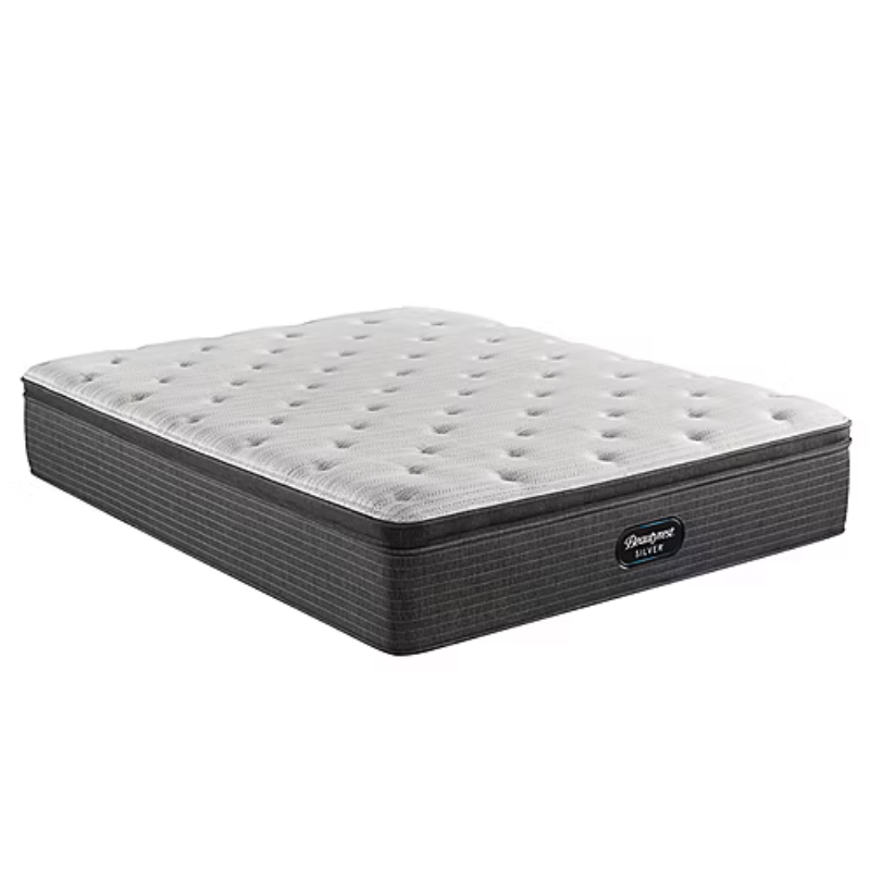 A mattress with a tufted white top and a dark gray patterned base labeled \“Beautyrest Silver.\“