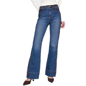 Gap High Rise '70s Flare Jeans feature a classic blue denim, high-waisted fit, and wide flared legs with prominent seams and a cuffed hem.