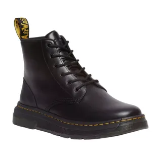 Black lace-up boot with a yellow AirWair heel loop and yellow stitching on the sole, featuring a chunky treaded platform.