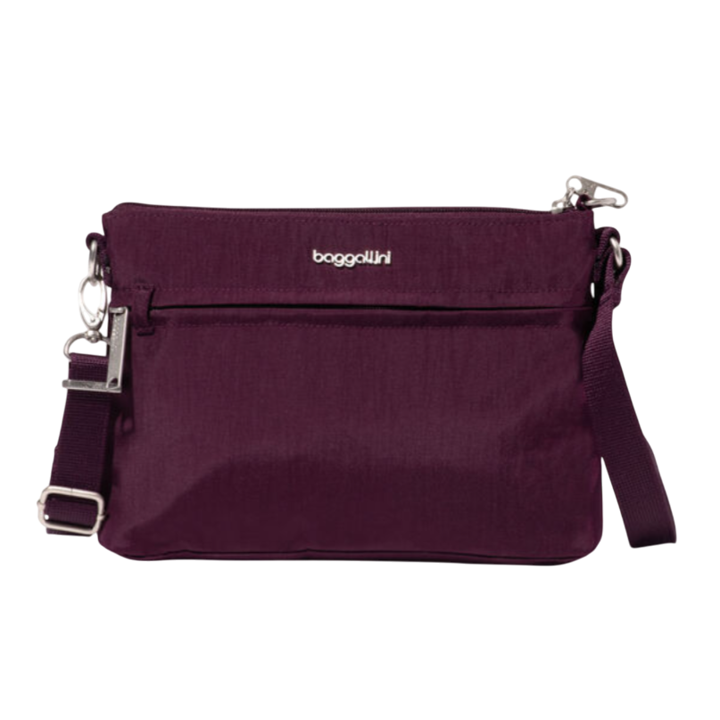 A purple Baggallini crossbody bag with a zippered main compartment, adjustable strap, and silver-tone hardware.