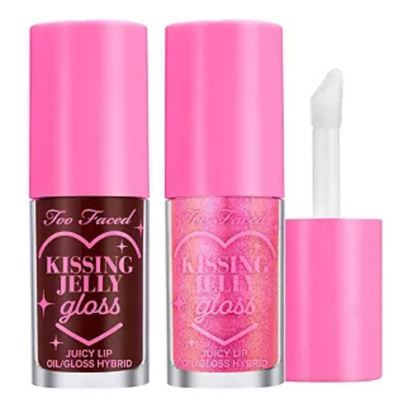 A 2-piece set of Too Faced Kissing Jelly Glosses features two tubes with bright pink caps. One is a deep red-brown shade, and the other is a shimmering pink. Both are labeled as \“Juicy Lip Oil/Gloss Hybrid.\“