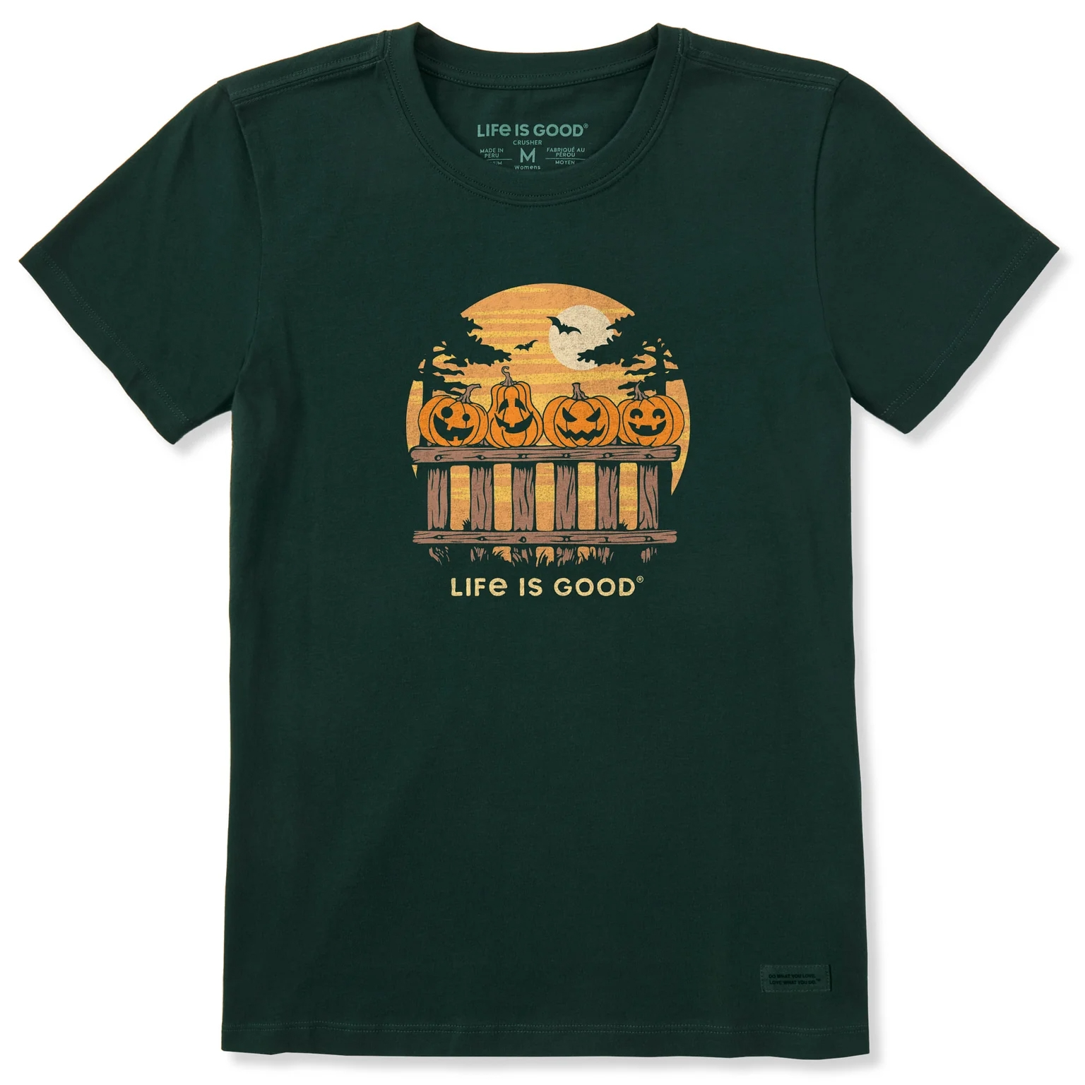 Dark green T-shirt featuring a design with jack-o'-lanterns on a fence, a full moon, and bats, with the text \“Life is Good.\“