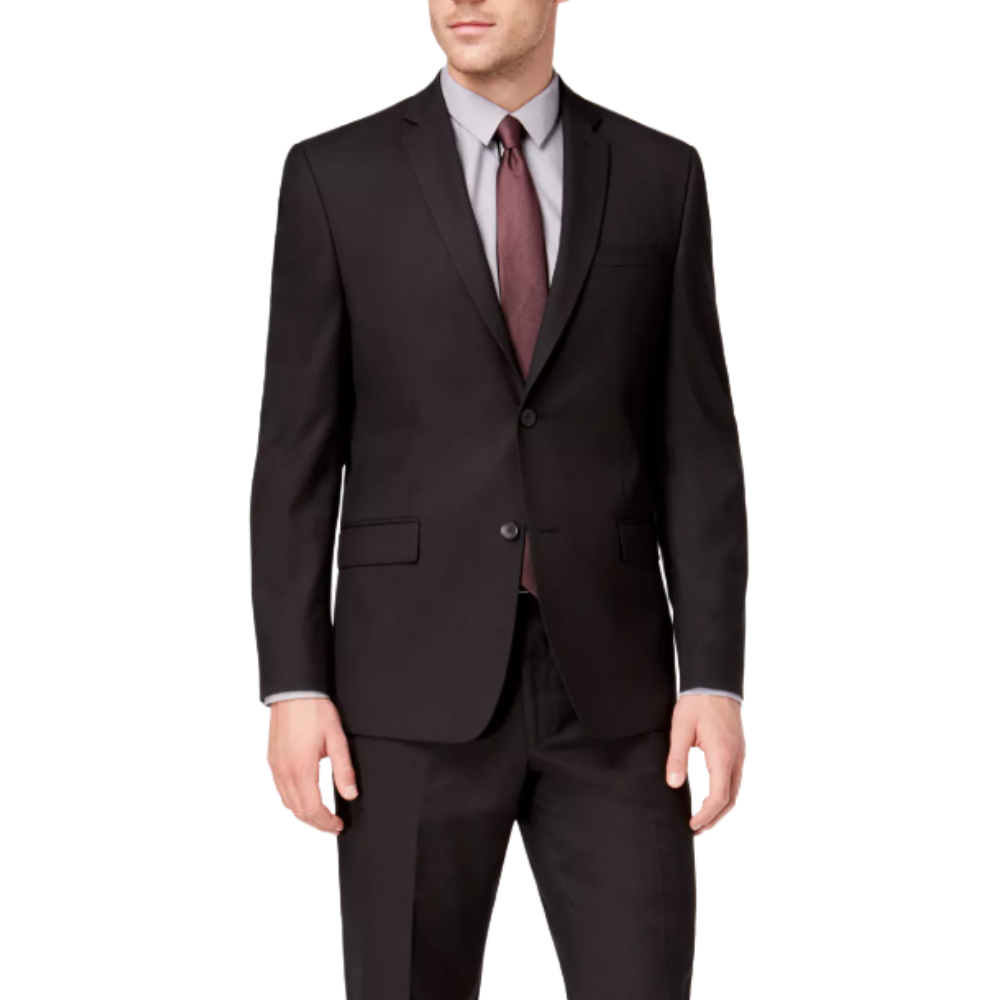 A man is wearing a formal black suit with a gray shirt and a dark red tie. The suit features a two-buttoned jacket and matching trousers.