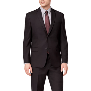 A man is wearing a formal black suit with a gray shirt and a dark red tie. The suit features a two-buttoned jacket and matching trousers.