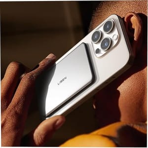 A person holds a smartphone with three rear cameras, featuring a silver Lisen-branded accessory attached to the back.