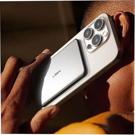 A person holds a smartphone with three rear cameras, featuring a silver Lisen-branded accessory attached to the back.