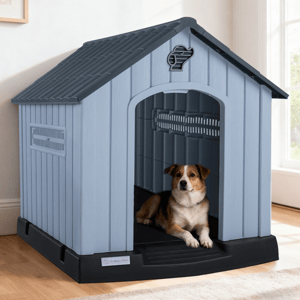A dog is lying inside a blue plastic doghouse with a black base, featuring ventilation slats and a dog-shaped cutout for decoration.