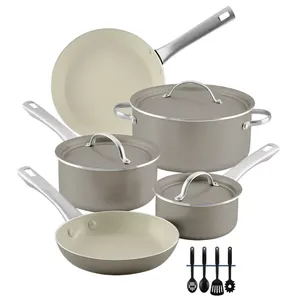 Cookware set with two frying pans, three saucepans with lids, and various utensils, featuring a beige non-stick interior and stainless steel handles.