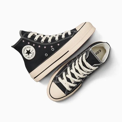 Black high-top Converse Chuck Taylor sneakers with an elevated platform sole and classic star-centered ankle patch.
