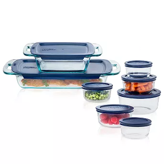 A set of glass food storage containers with blue lids in various shapes and sizes.