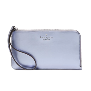 A Kate Spade medium wristlet in a light blue color with a simple design, featuring a wrist strap and the brand logo on the front.