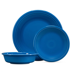 A 3-piece Fiesta Dinnerware Set in vibrant blue, featuring a large dinner plate, a smaller salad plate, and a bowl, all with a classic ring pattern.