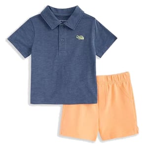 A toddler boy's outfit consisting of a blue polo shirt with a small turtle logo and orange elastic-waist shorts.