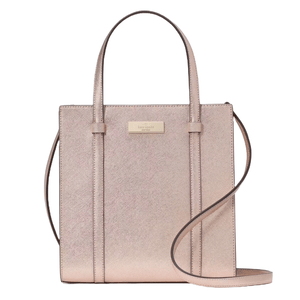 Kate Spade Kenzie Tote in rose gold features a structured silhouette with dual top handles and a detachable shoulder strap, offering a sleek, metallic finish ideal for versatile styling.