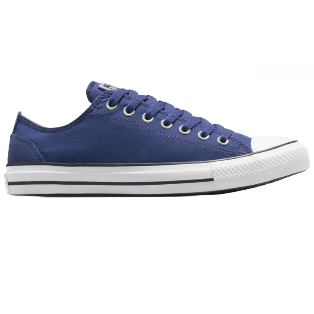 Men's low-top Converse sneakers in blue with white rubber soles and black accents. They feature metal eyelets and white toecaps.