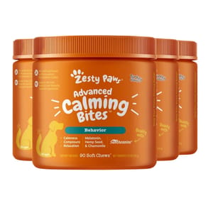 Three containers of Zesty Paws Advanced Calming Bites for dogs, turkey-flavored with supplements like melatonin and chamomile.