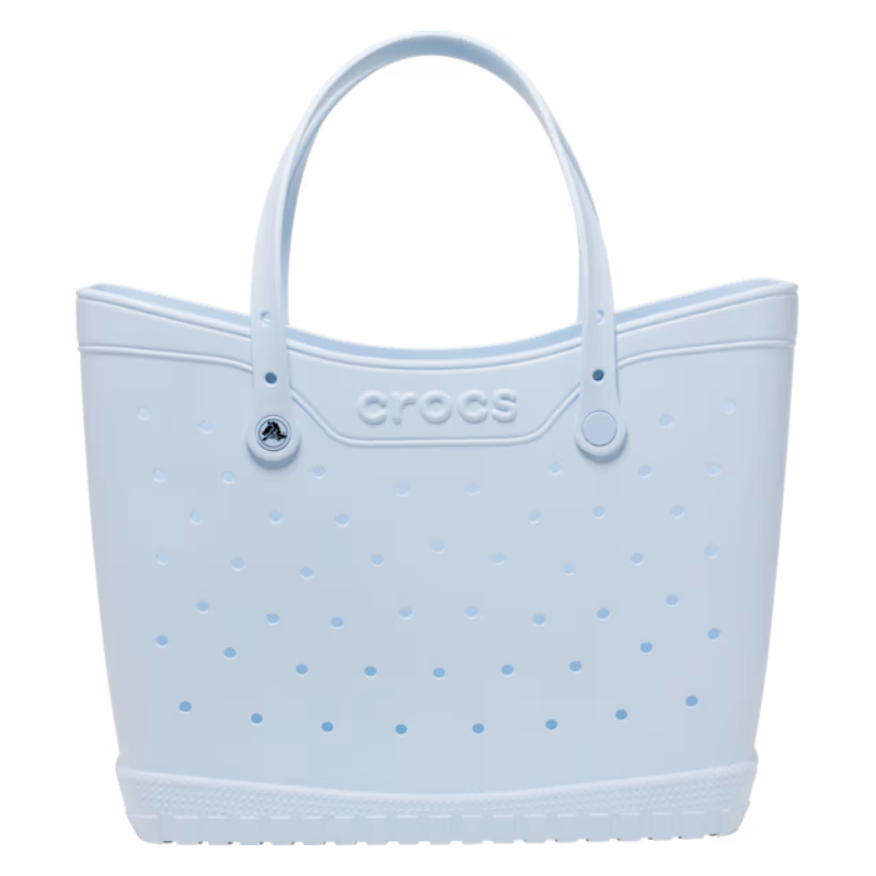 Light blue Crocs Classic Large Tote with perforated design, dual handles, and logo on the front.