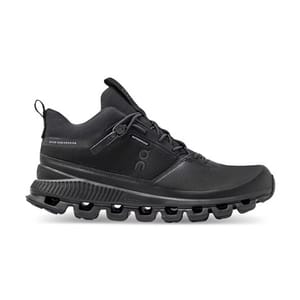 Black athletic shoe with distinctive ridged sole and a pull tab on the heel for ease of putting on.