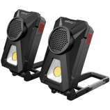 Two Infinity X1 portable LED work lights, each with a built-in speaker, featuring a foldable handle for easy positioning and carrying.