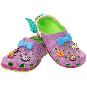 A pair of colorful clogs featuring a purple and green design with cartoon-themed decorations, including blue bows and various character charms.
