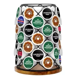 A rotating K-Cup pod holder features a selection of coffee pods including Laughing Man, Green Mountain, Donut Shop, and Timothy’s brands.